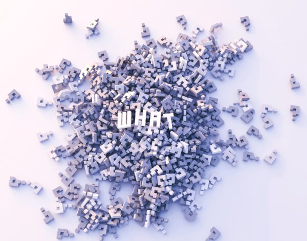 A pile of purple question marks with "WHAT" spelled out on top in white letters.